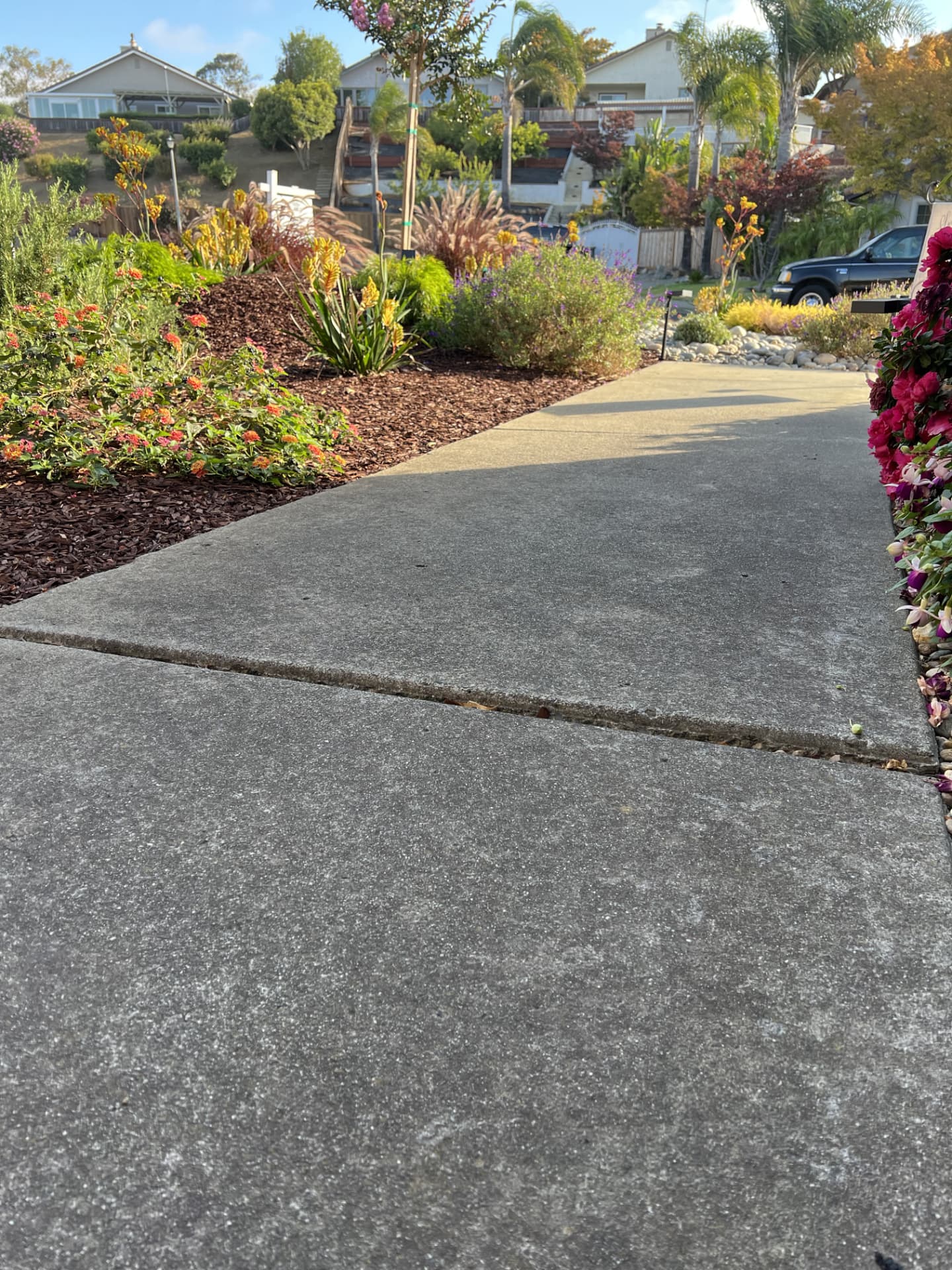 Driveway slab settled at the joint leaving an uneven lip